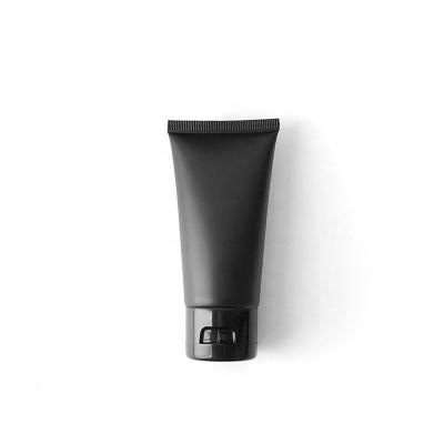 China BEAUTY PACKAGING Black Color Skin Care Packaging Frosted Plastic Cosmetic Tube With Flip Cap for sale