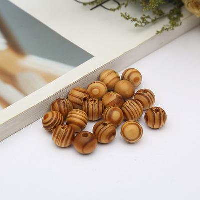 China DIY Wooden Creative Beads Wholesale Environmental Natural Wood Beads Decorative Round Wooden Beads Crafts DIY Jewelry Making Home Favor Holiday Decor for sale