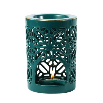 China Luxury Modern Unique Design Home Accessories Hollow Out Luxury Ceramic Candle Aroma Kerosene Lamp Burner Tealight Candle Burner for sale