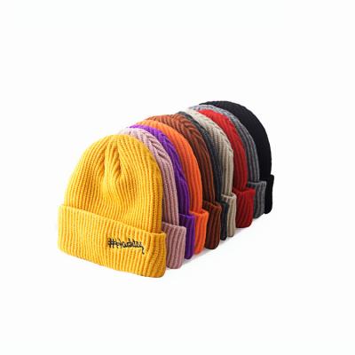 China Custom Winter Solid Color Casual Knitted Beanie Cap Hat Embroidered Logo Unisex for sale