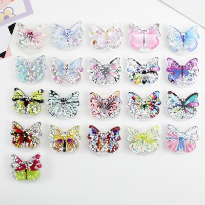 China Universal Adjustable Phone Holder Butterfly Glitter Quicksand Phone Grip Handle UP Fold Telescopic Stand for sale