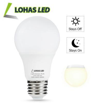 China Residential A60 6W LED Light Bulb Twilight Unborn LED Sensor Light Bulb for sale