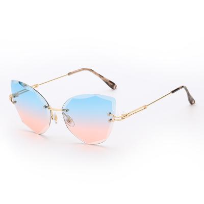 China Polygonal Online Colorful Rimless Glass Sunglasses Fashion Sun Glasses Ladies Discount Glasses for sale