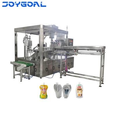 China Automatic Liquid CLOTHING Water Spout Pocket Juice Capping Machine Mango for sale