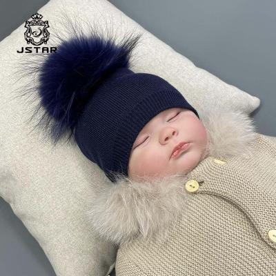 China Winter Genuine COMMON Raccoon Fur Pompom Hats For Baby High Quality Merino Wool Knitted Hats Beanie Hats Fashion Thick for sale