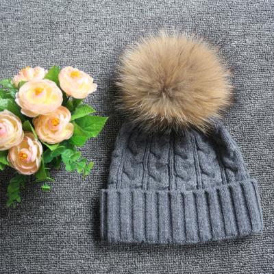 China COMMON COMMON Sheep Fur Knitted Beanie Hat Winter Women Wool Warm Raccoon Fur Pompom Hat for sale