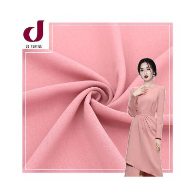 中国 Fashion style breathable and quick dry cloth plain woven polyester 180D 100% cey fabric crepe for dress 販売のため