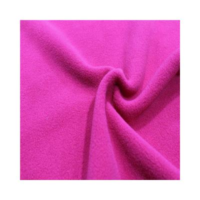 China 100% Polyester micro fleece 150D/144F DTY two side brush one side antipilling fabric winter coat en venta