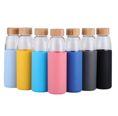 China Sustainable Thick Borosilicate Glass Water Bottle With Protective Silicone And Bamboo Sleeve Lid for sale