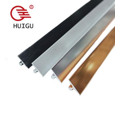 China Modern HUIGU Hardware Decoration Accessories Metal Floor Trim Stick On Flooring Trim for sale