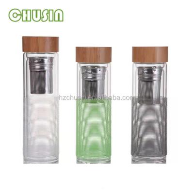 China Sustainable glass water bottle with colored lines and stripes for sale