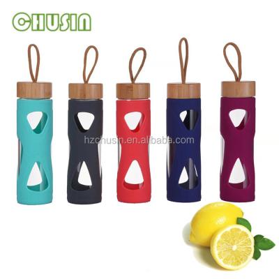 China Custom Sustainable Wooden Bamboo Sleeve Silicone Lid Glass Water Bottle With Silicone Sleeve for sale