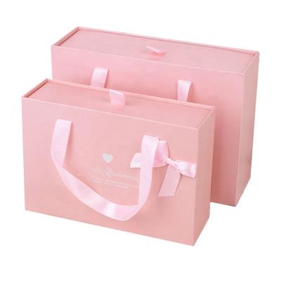 China Unique Shape Recyclable Paper Bag With Ribbon Kraft Paper Gift Bags Handles Restaurant Handle Pink Your Own Logo Twisted for sale