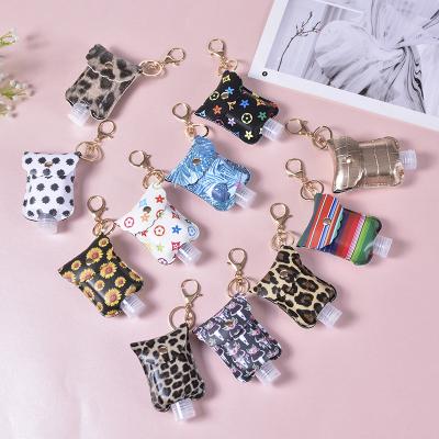 China PU Child and Adult Leopard Logo Soft Solid Color Sanitizer Leather Holder for 60ml Hand Sanitizer Gel Bottle with Keychains for sale