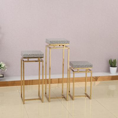 China Metal / Marble Standard And Professional Store Design Nesting Rose Gold Metal Tables Clothing Display for sale