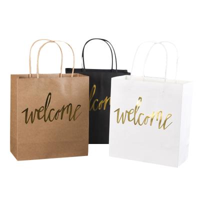 China Recyclable China manufactures custom foil Logo Printed bolsas de papel white luxury carrier gift gold stamp wrapping paper with handle for sale