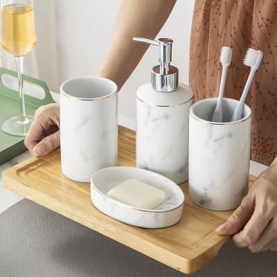 China Viable Modern Luxury Home Hotel Decoration Design Product 4PCS Ceramic Toothbrush Holder Bathroom Accessory Set for sale