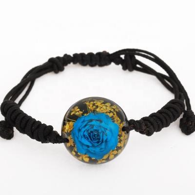 China Real Flower Enclosed Beauty and Pretty Fancy Keepsake Flower Bangle Resin Bracelet with Black Band for sale