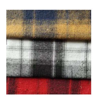 China Breathable Cheap Price Stock 60%cotton 40%polyester Yarn Dye Brushed Fabric Check Designs CVC Yarn Dye Flannel Fabric For Shirt for sale