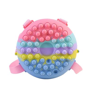 China Sustainable Silicone Rainbow Trigger Toys Donut Backpack Water Proof Unicorn Shape School Bag for sale