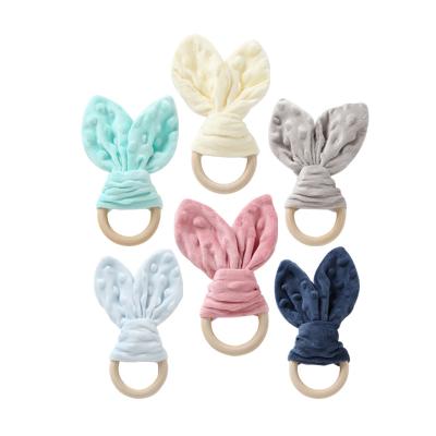 China 100%food grade new silicone Teether rabbit ears milk teeth bite toy skullcap velvet milk tooth chewer for sale