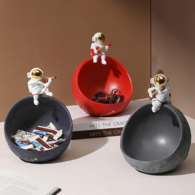 China China Resin Cosmonaut Astronaut Sculpture Model Decoration Key Chain Storage Box Creative Dried Fruit Dish Home Decoration for sale