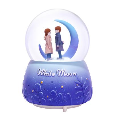 China Factory direct daily gifts artificial travel souvenirs sale manual painting resin open cartoon water ball snow globe music box for sale