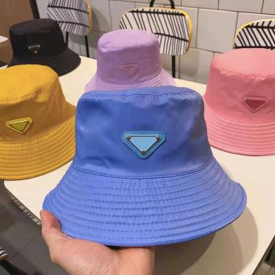 China Wholesale Character Designer Bucket Hats Metal Logo Classical Luxury Hat Sunshade Bucket Hat for sale