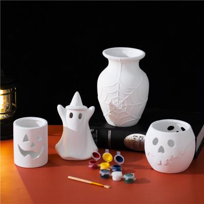 China Safety Creative design ghost shape tealight holder home halloween decoration ceramic halloween gift for sale