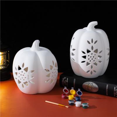 China Safety Holiday gift home decoration diy coloring pumpkin shape ornament ceramic halloween decoration for sale