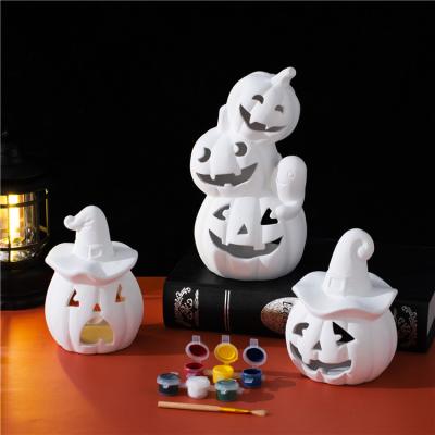 China Safety New design halloween ornaments pumpkin candle holder custom diy color ceramic halloween decoration for sale