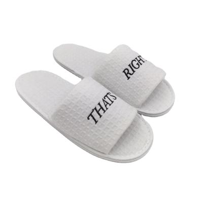 China Cheap custom logo five star waffle embroidery hotel disposable slippers 27cm for sale