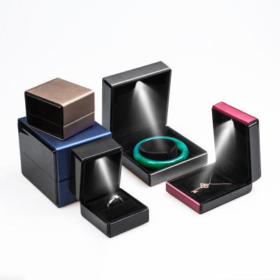 China Jewelry Package Brushed PU Jewelry Packaging Box LED Light Necklace Ring Bracelet Jewelry Box Watch Light Box for sale