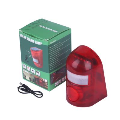 China Outdoor Motion Sensor Solar Anti Theft Alarm Lamp Security Alarm Light QXTX-AL-1 for sale