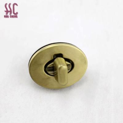 China Use in handbag fashion antique brass turn oval metal turn lock for handbags for sale