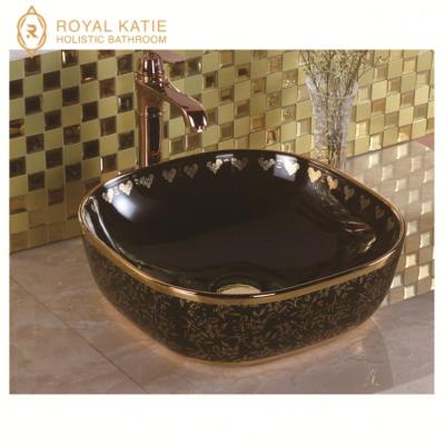 China Wash basin factory direct supply painted ceramic bathroom sinks, art basin with gold color, black gold basin for sale