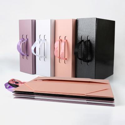 China Recycled Packaging Materials FocusBox Shoe Custom Clothing Paper Foldable Magnetic Gift Box With Ribbon Handle for sale