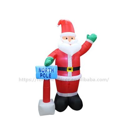 China Inflatable Santa Festival Decoration 240cmH 8ft Christmas Decoration With Guideboard With Sign NORTH POLE Giant Inflatable Outdoor Santa Christmas for sale