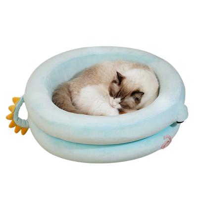 China Removable Luxury Pet Bed Atopy Blanket Fluffy Soothing Round Donut Cat Beds For Indoor Cats for sale