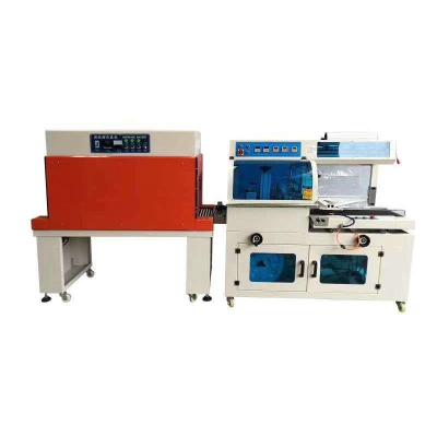 China Wiind FQ450 L Automatic POF PE Film GARMENT Heat Sealer Automatic Shrink Tunnel Wrapping Wrapping Machine For Boxes for sale