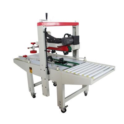 China UJ111 Food Top And Bottom Drive Carton Case Box Sealing Machine Semi Automatic Adhesive Tapesper For Cartons for sale