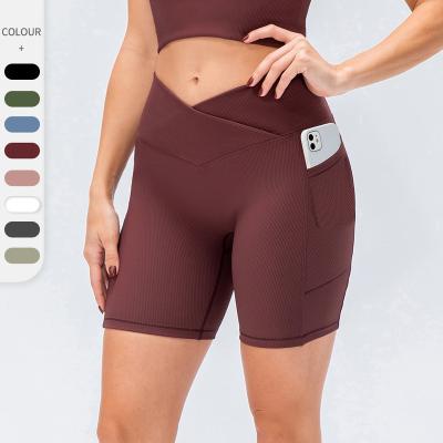 China Lulu New Women Breathable Yoga Shorts Cross Waist Tight Fitness Pants Pockets High Waist Sports Lifting Running Shorts for sale