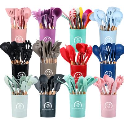 China 2022 Hot Selling 12 Pieces Silicone Home Kitchen Viable BPA Free Cookware Set With Stand Wood Handle Nonstick Cookware Tools for sale