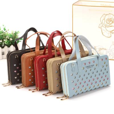 China Retro waterproof European and American ladies hollow out PU wallet one shoulder messenger coin purse fashion phone bag with shoulder strap for sale