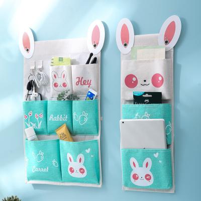 China New Cartoon Viable Cotton and Wholesale Creative Bedside Hanging Hanging Bag Canvas Storage Bag Wardrobe Door Debris Storage Bag for sale