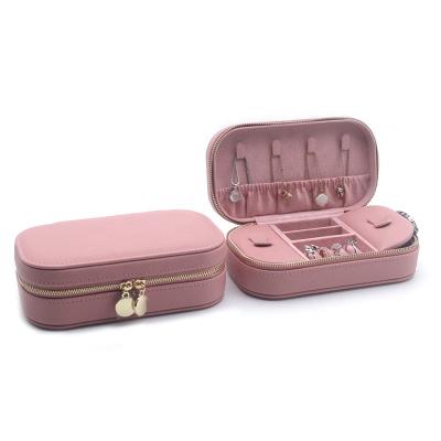 China Newest Wholesale Pink Velvet Leather Gift Zipper Storage Rectangle Travel Jewelry Box Case for Earrings Rings Necklaces for sale