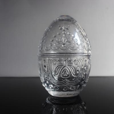 China Clear Shaped Viable Egg High Embossed Honey Jar / Glass Candy / Candle Jar With Lid for sale