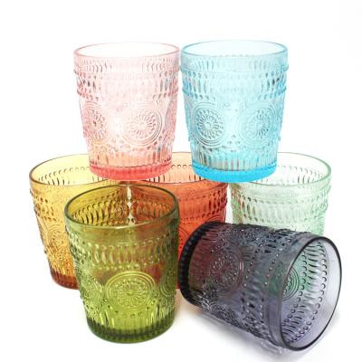 China Multifunctional sunflower embossed pattern colored tumble cup machine drinkware raw glass drinkware type for sale