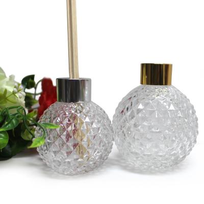 China Personal Care 100ml Round Embossed Luxury Decorative Reed Diffuser Bottles With Silver Cap for sale