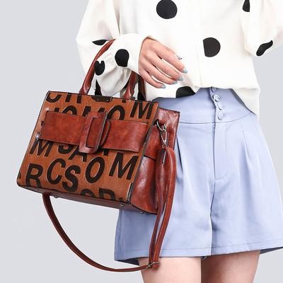 China 2021 New Brand Designer Ladies Handbags Bags Printed Women Famous Multifunctional Messenger Handbags With Ribbon Bow for sale